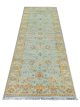 Amritsari floral runner handknotted wool carpet with sky blue base and golden motifs – luxury oriental rug