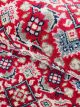 Ruby Grid Runner hand knotted wool carpet with red base, floral and geometric motifs, and elegant border – luxury oriental rug