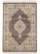 Handknotted wool oriental carpet with grid design, central motif, and black, gold, red border – luxury rug