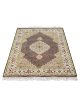 Handknotted wool oriental carpet with grid design, central motif, and black, gold, red border – luxury rug