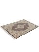 Handknotted wool oriental carpet with grid design, central motif, and black, gold, red border – luxury rug