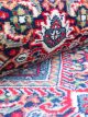 Handknotted wool oriental carpet in red with intricate motifs – luxury regal rug