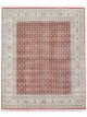 Hand knotted wool carpet with rust base, geometric patterned background, and floral border – luxury oriental rug