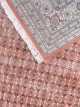 Hand knotted wool carpet with rust base, geometric patterned background, and floral border – luxury oriental rug