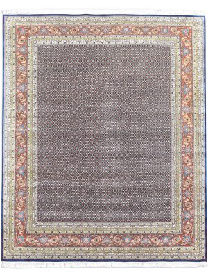 Midnight Garden hand knotted wool carpet with dark blue base, geometric patterned background, and floral border – luxury oriental rug