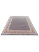 Midnight Garden hand knotted wool carpet with dark blue base, geometric patterned background, and floral border – luxury oriental rug