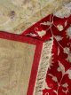 Handknotted wool oriental carpet with golden leaves on red background – luxury regal rug
