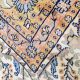 Shalimar hand-knotted viscose rug with Oriental medallion, floral vines, and paisley border in navy, ivory, gold, and terracotta tones