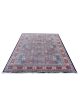 Regal Mosaic hand-knotted wool rug with deep red, blue, green, and rust tones in geometric mosaic design with black outlines