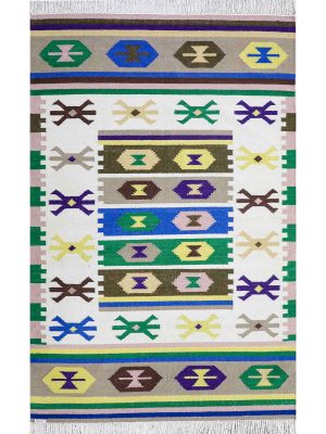Flatwoven dhurrie with hexagon and link motifs in olive, yellow, and purple – geometric artisanal rug