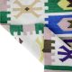 Flatwoven dhurrie with hexagon and link motifs in olive, yellow, and purple – geometric artisanal rug