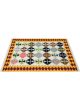 Flatwoven dhurrie with hexagon and inner link motifs in warm tones of brown, yellow, blue, and green – artisanal geometric rug