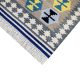 Flatwoven dhurrie with hexagon and inner link motifs in blue, yellow, brown, and grey – modern geometric rug
