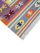 Flatwoven carpet with multicolor Aztec motifs on pink base – geometric artisanal rug