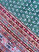 Handknotted emerald green wool carpet with red border and paisley motifs – luxury oriental rug
