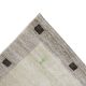 Beige hand-knotted wool carpet with brown squares and small human motif Rooted Muse