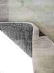 Beige hand-knotted wool carpet with brown squares and small human motif Rooted Muse